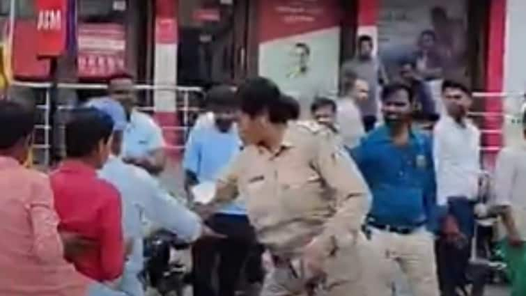 woman sub inspector catches trio on bike without helmet hugs him and returns fine after knowing college fees bagalkot viral video